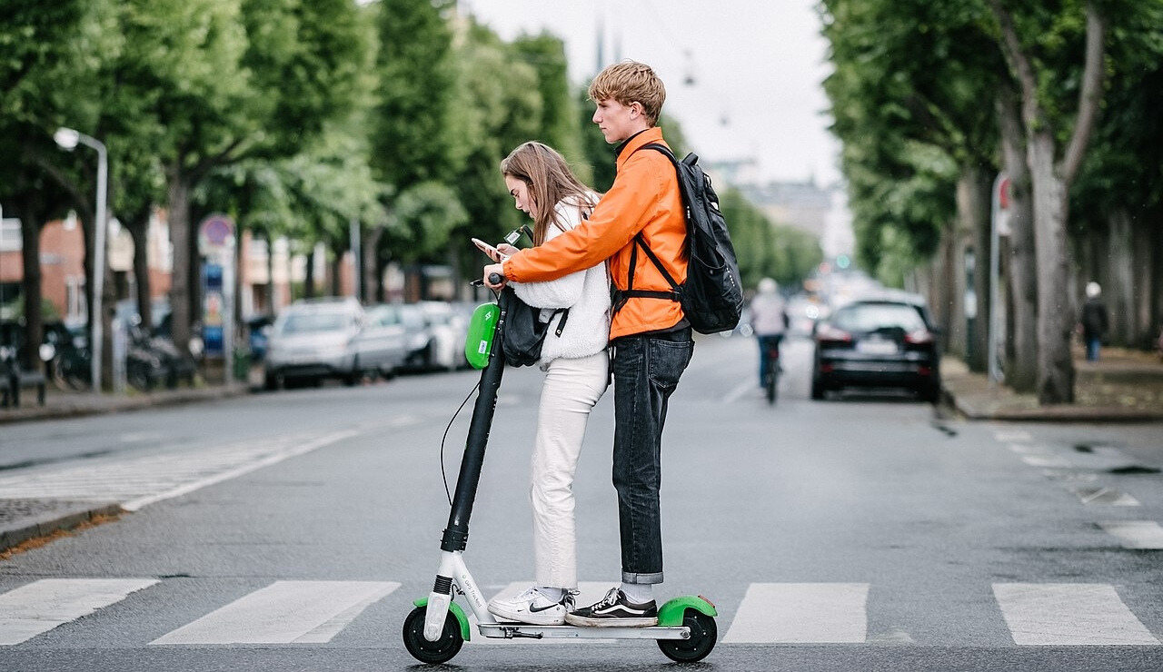 Two People on an Electric Scooter Why It s a Bad Idea