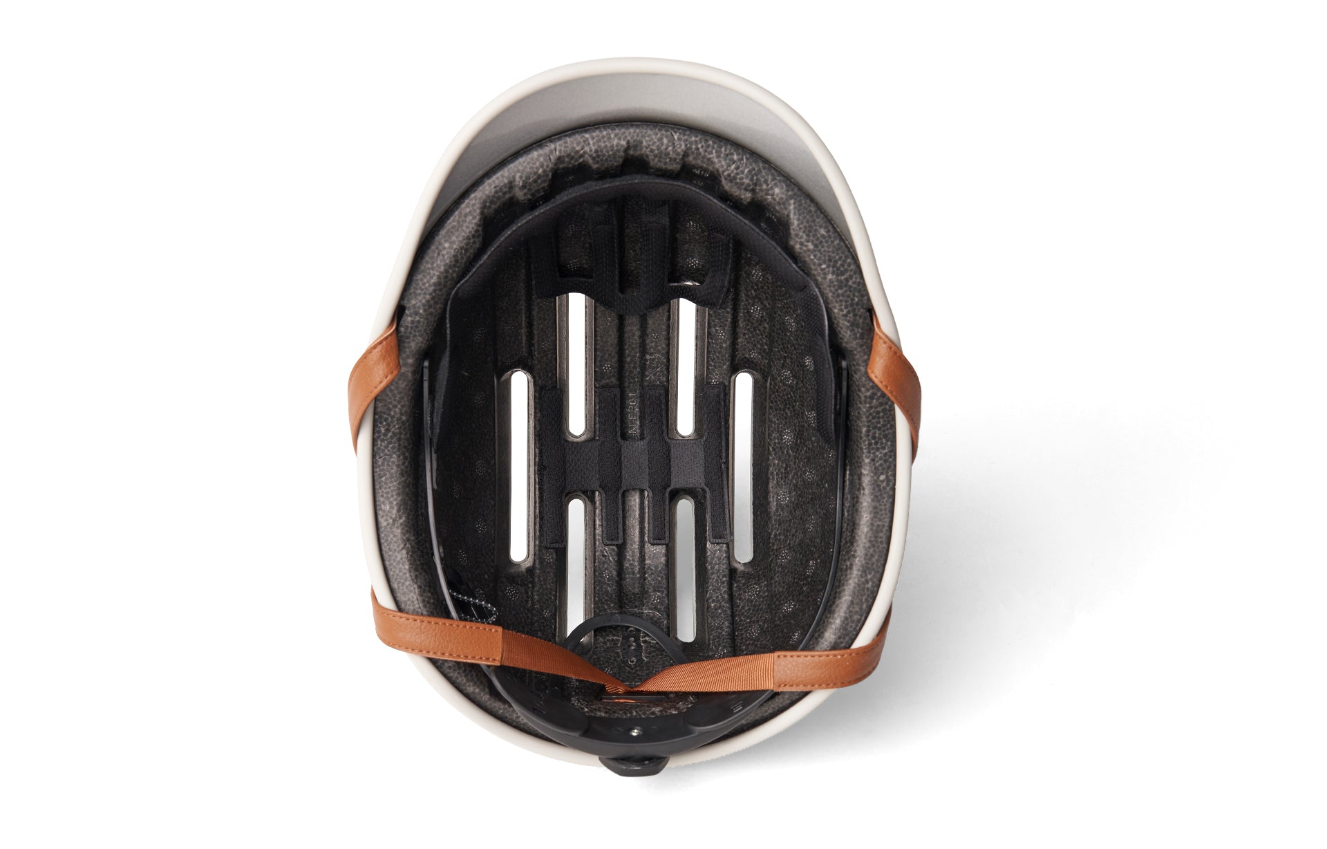 Ivory-colored cycling helmets with brown straps on a white background