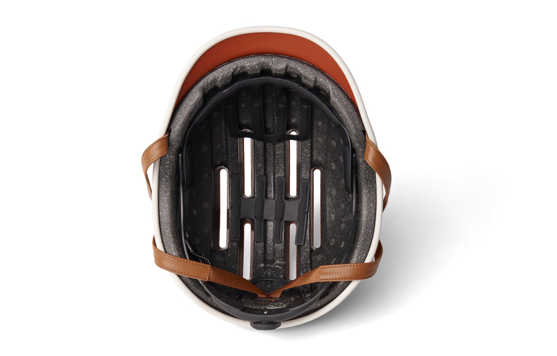 Black and white bike helmet with brown chin strap on white background