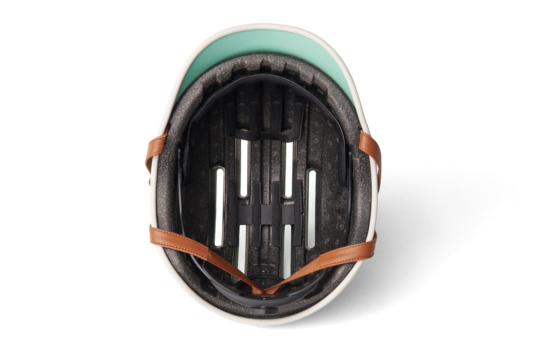 Close-up view of modern black cycle helmet with mint green and ochre brown straps