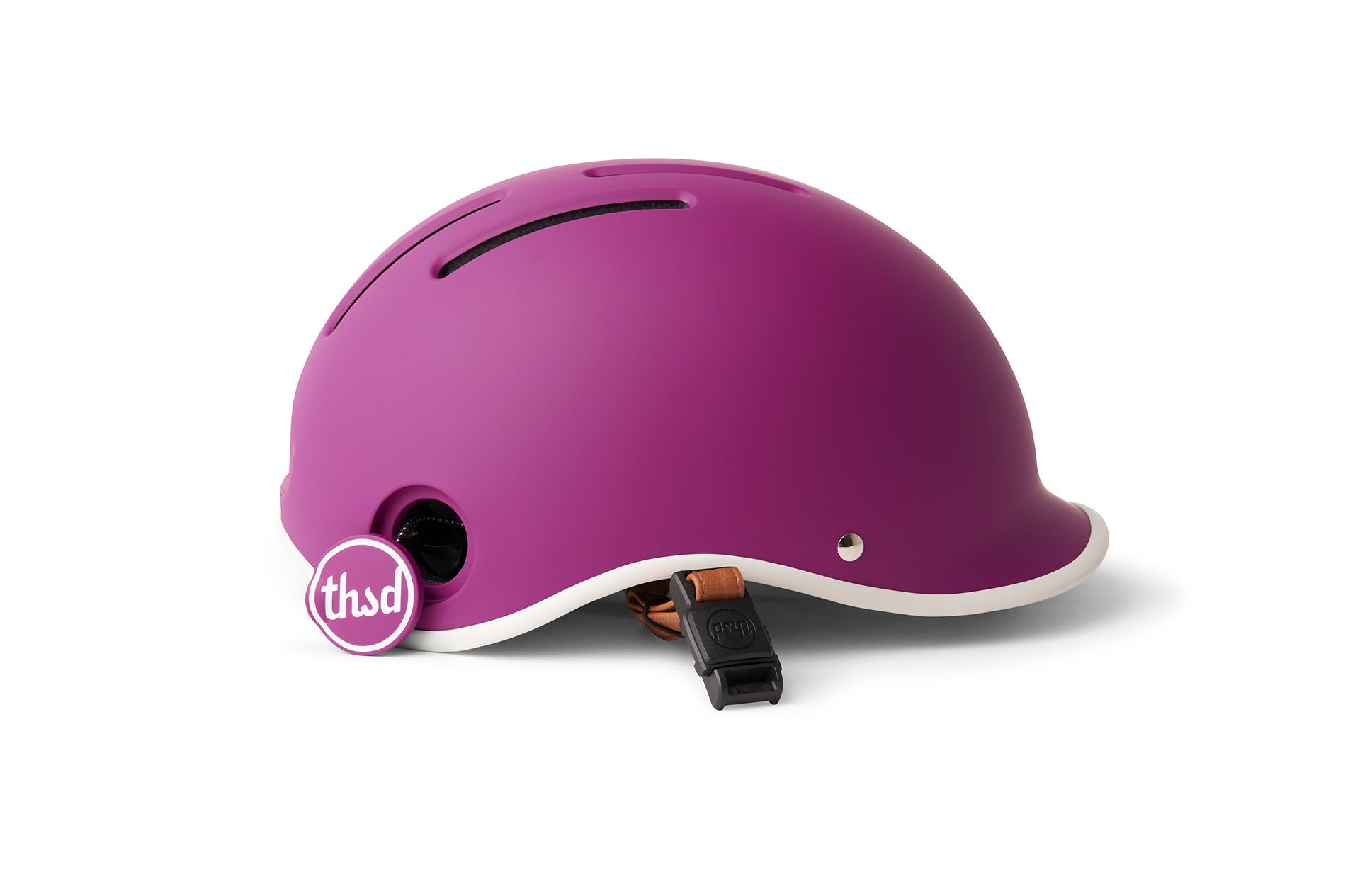 Purple bicycle helmet on white background with strap on bottom