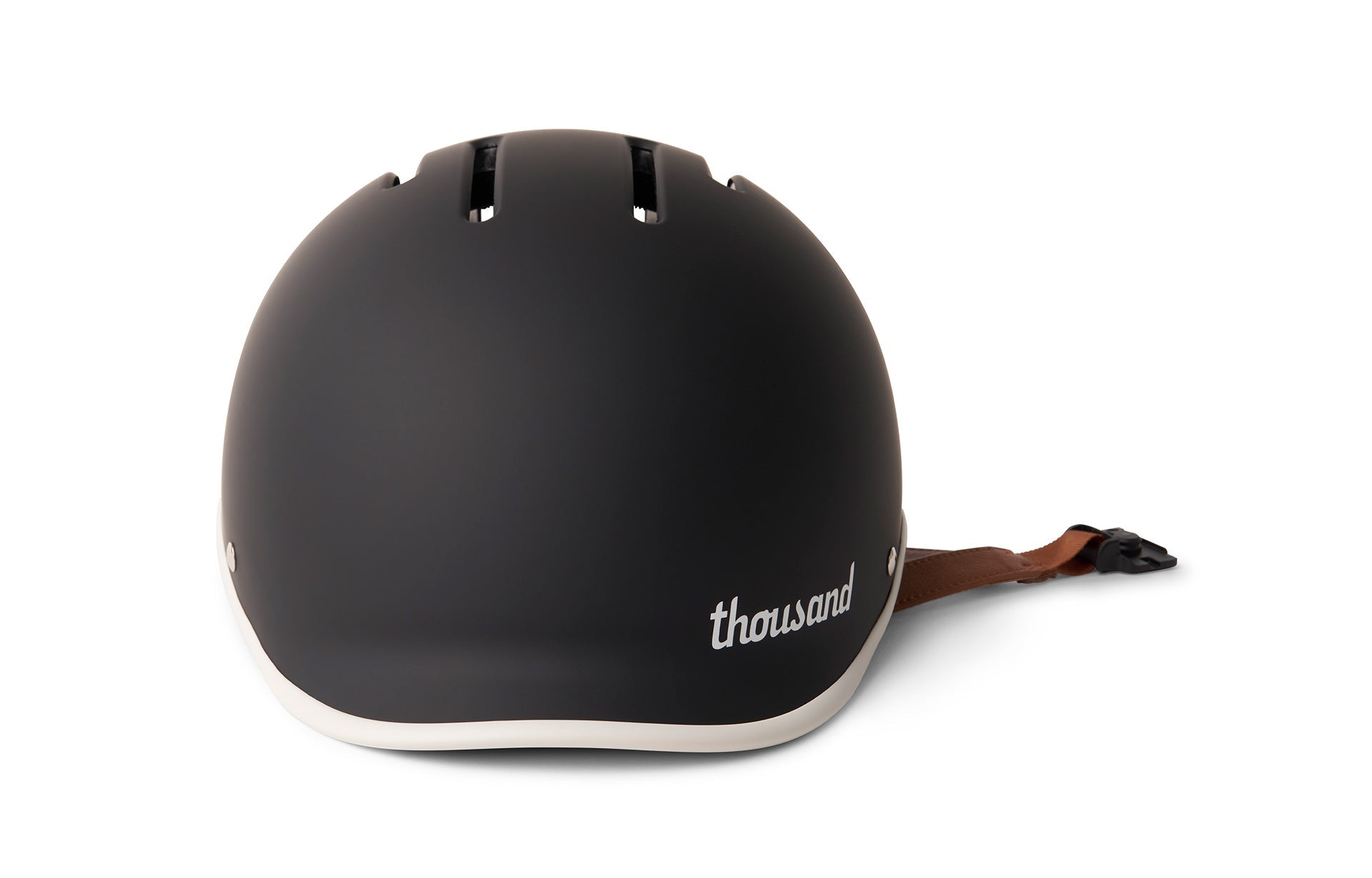 Black thousand helmet with brown strap and buckle on a white background
