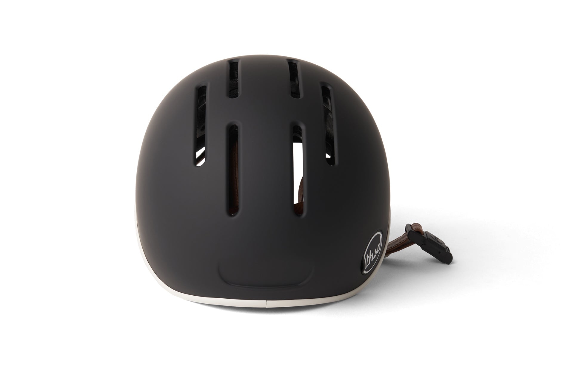 Photo of an oval shaped black cycling helmet with ventilation holes displayed against a white background.