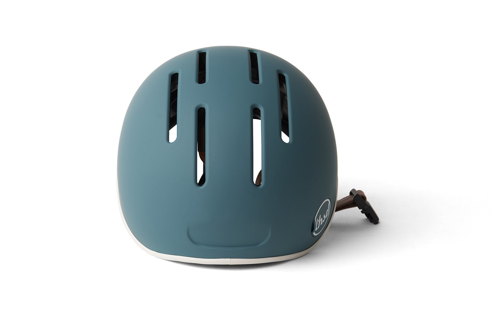 Close-up view of an adults bike helmet with ventilation holes and an internal retention strap