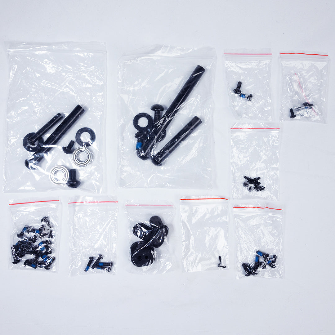 Bike pedals and bolts in plastic packages against a white background
