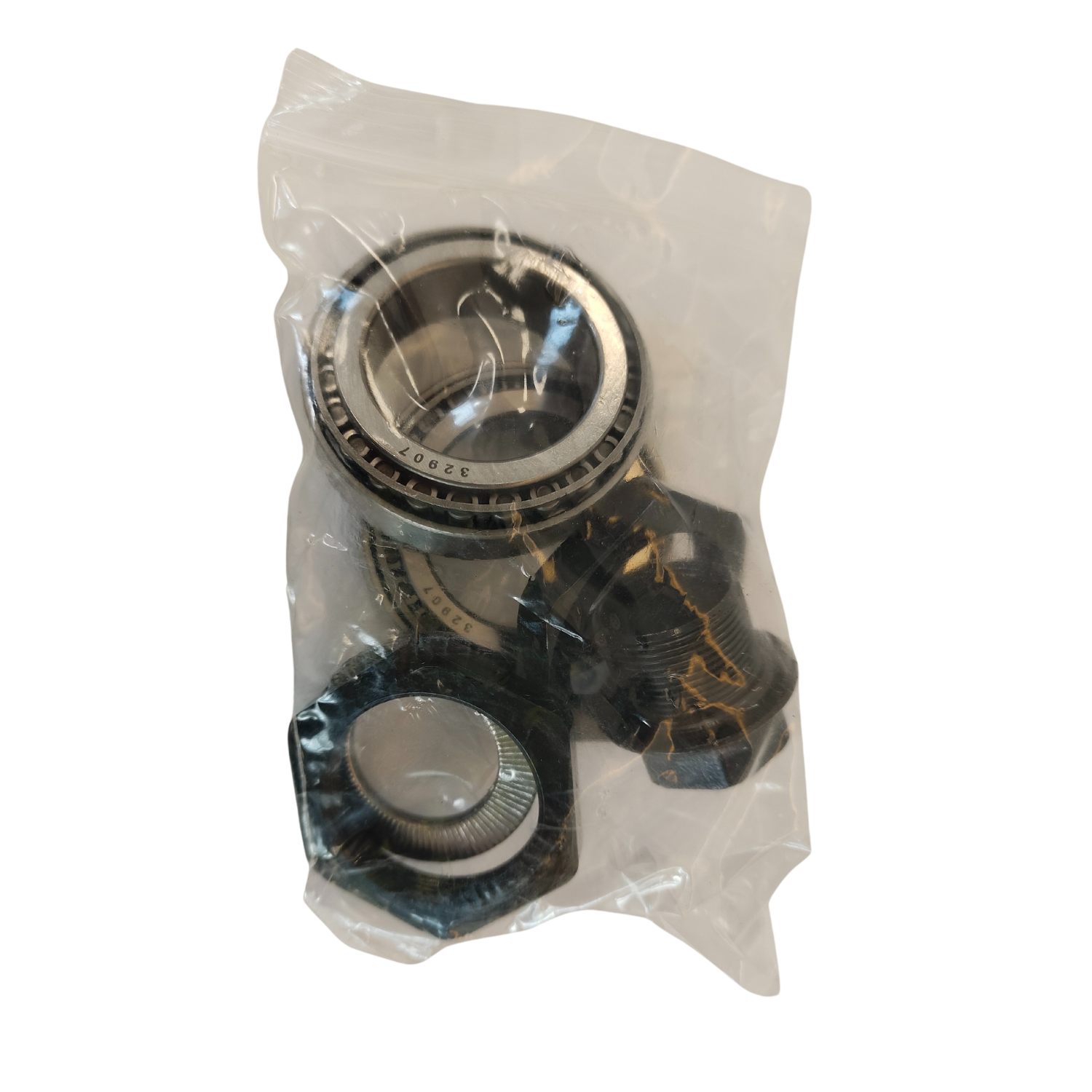 Metal bearing assembly showcased in a clear plastic package on a black background.