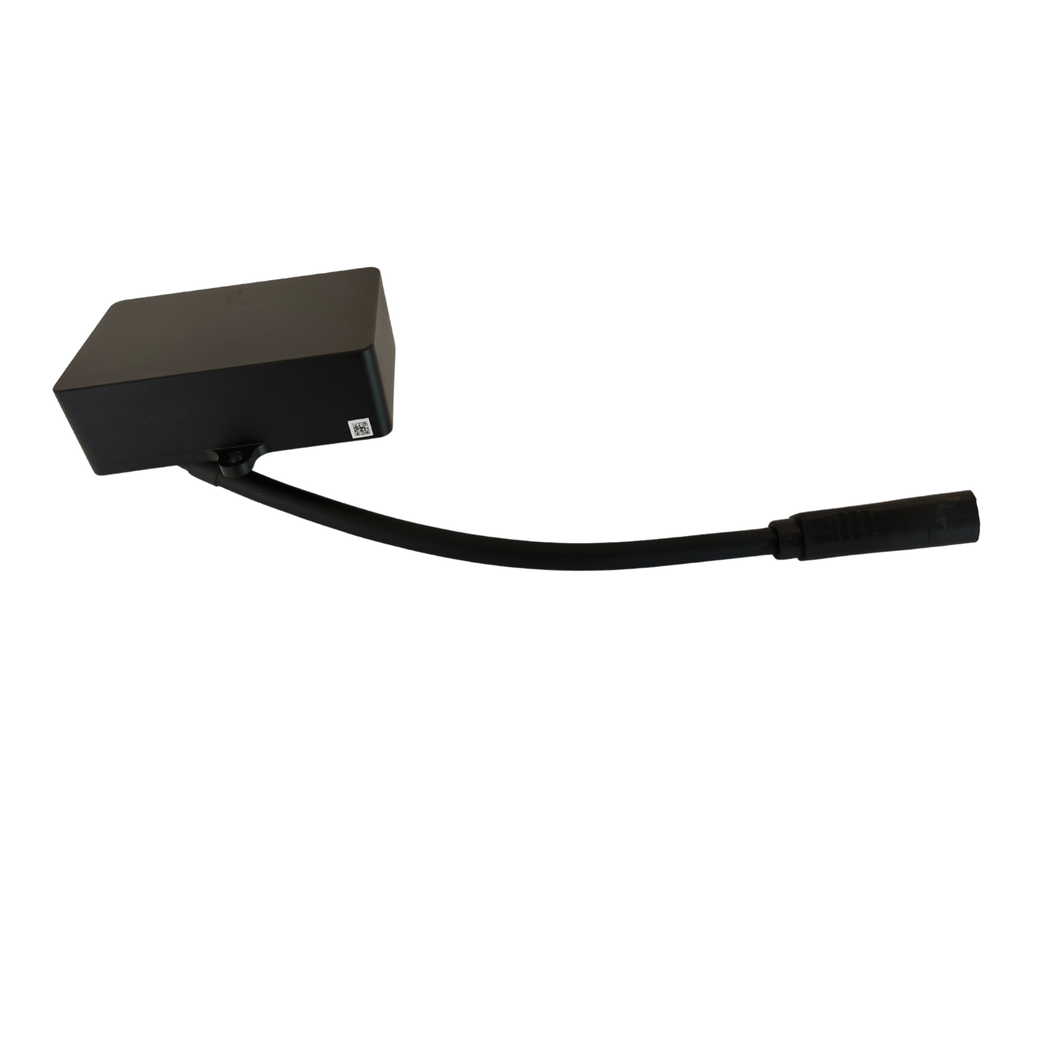 Closeup view of angled black power adapter connected with an oval shaped black cable