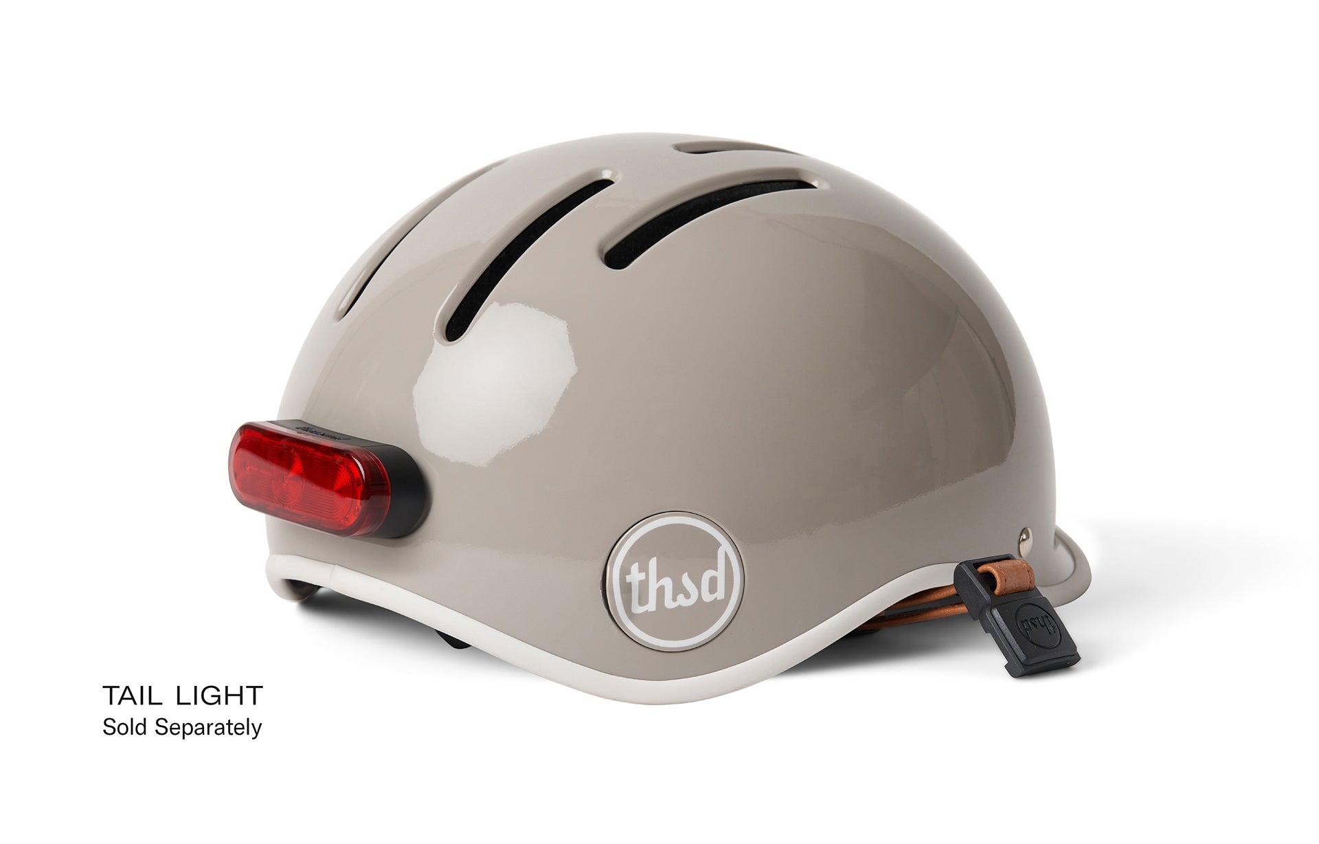 Helmet with red brake light from the back, text reads TAIL LIGHT Sold Separately.