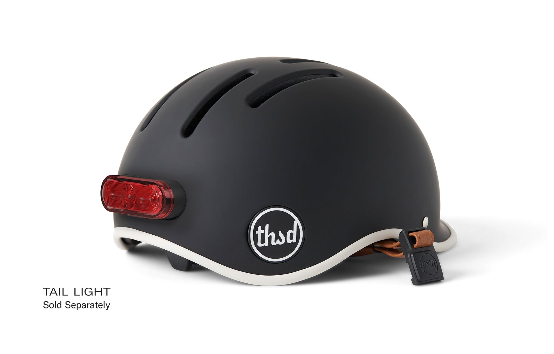 Image of black 'thsd' logo bicycle helmet, highlighting integrated lighting option at rear