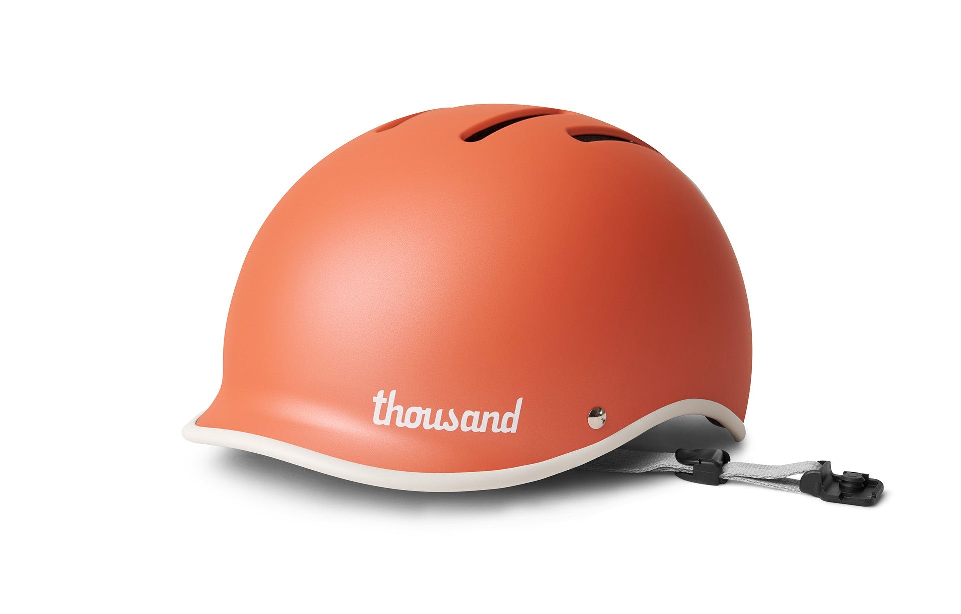 The Thousand branded coral orange full helmet on a white background