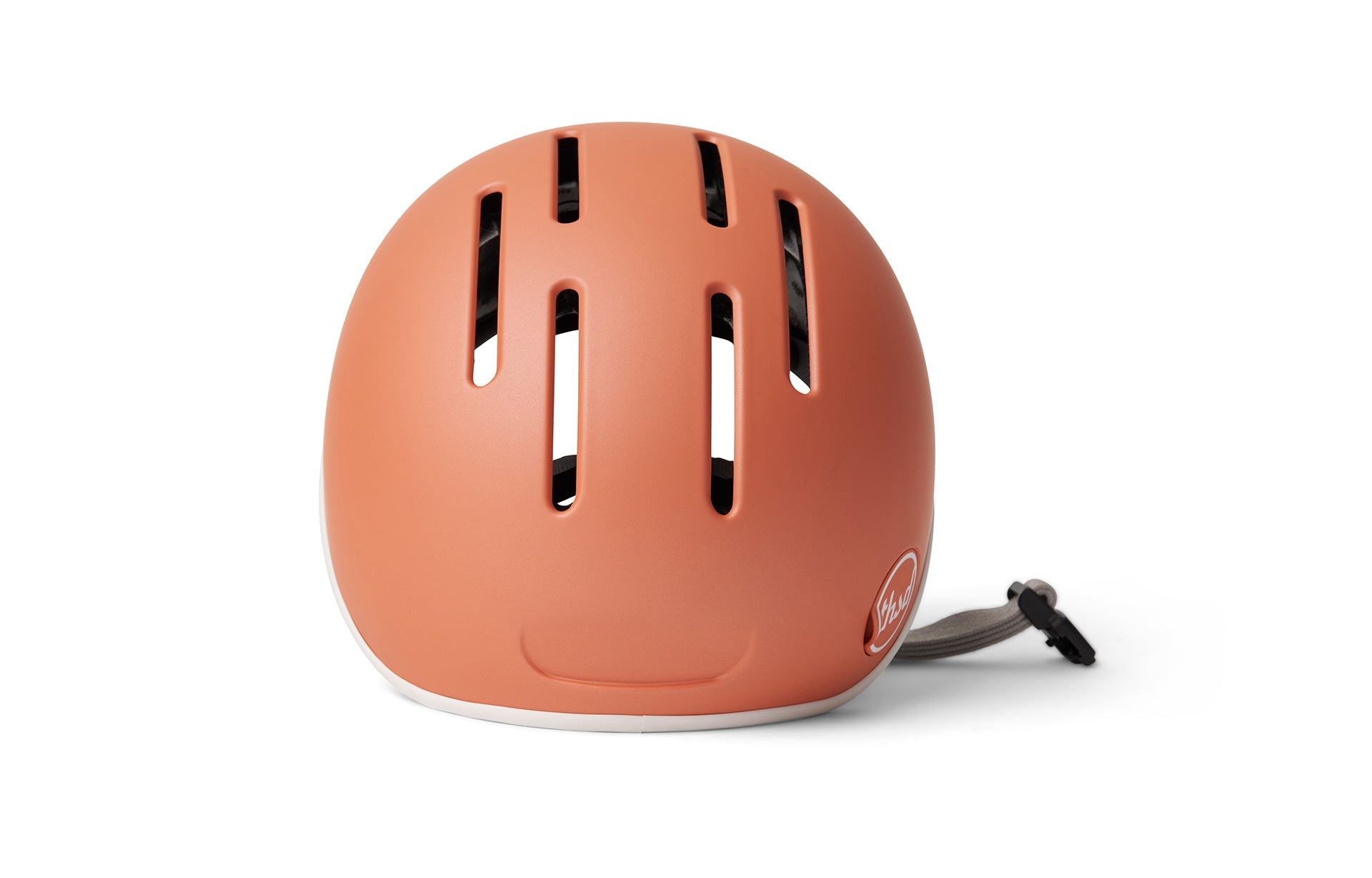 Safety orange Bell helmet with strap and ventilation slats on a plain white background