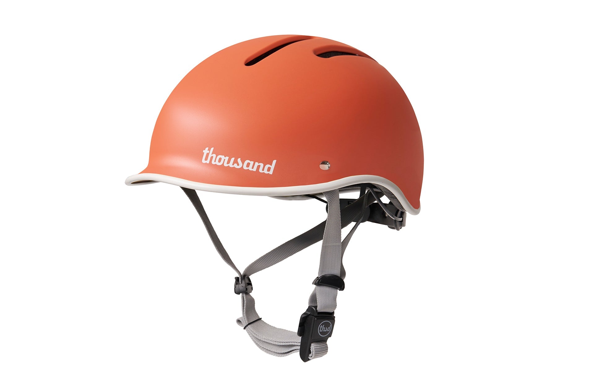 Thousand Coral Adult Helmet with grey straps facing left-side view on white background.