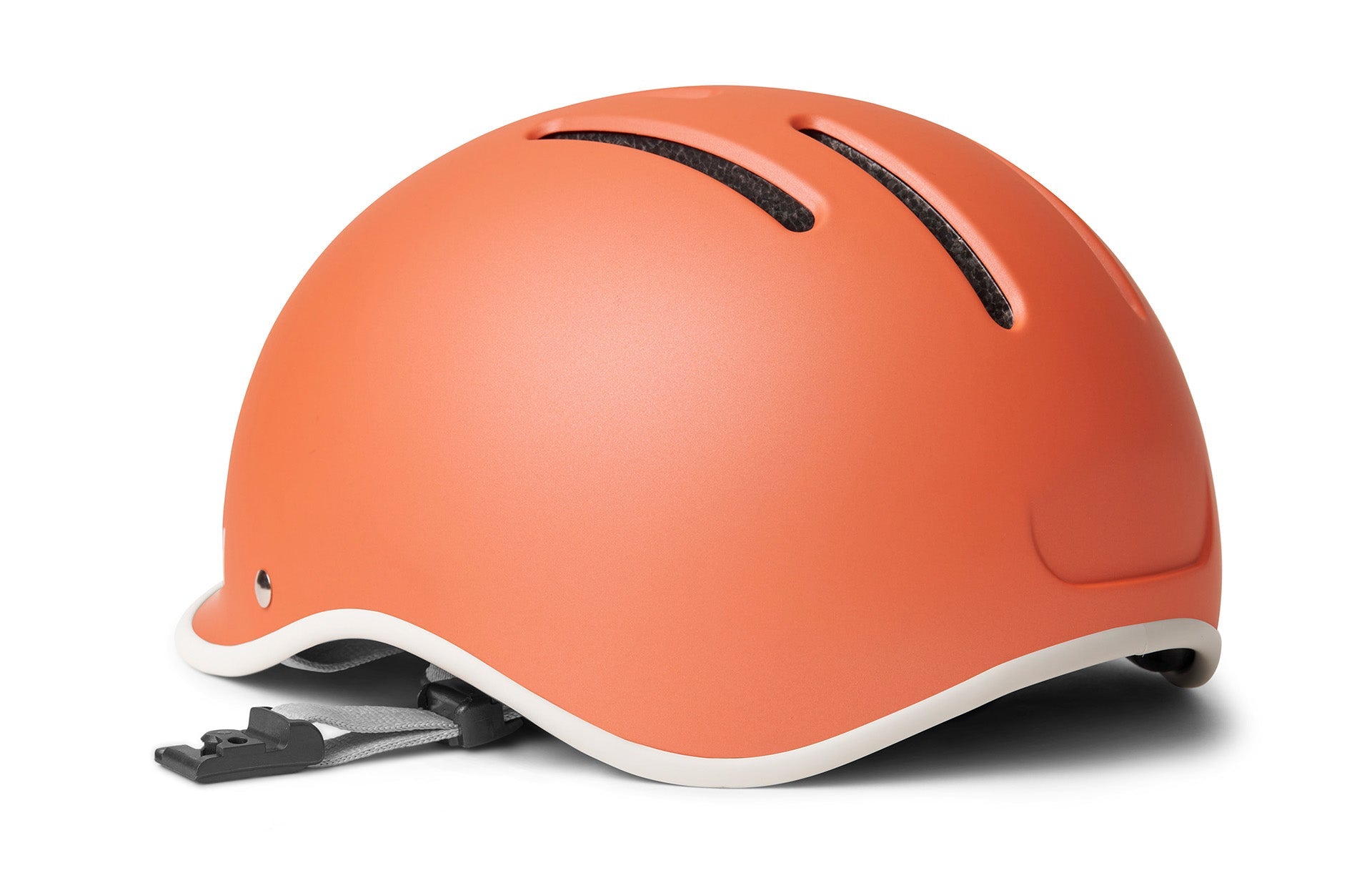 Orange cycling helmet with adjustable chin strap displayed in front of a white background.