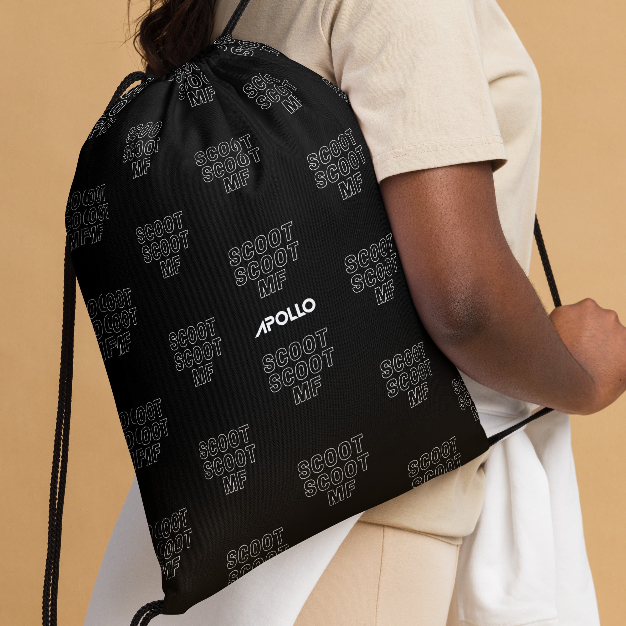 Black Apollo brand gym drawstring backpack with multiple white print repetitions of the word Scoot MF