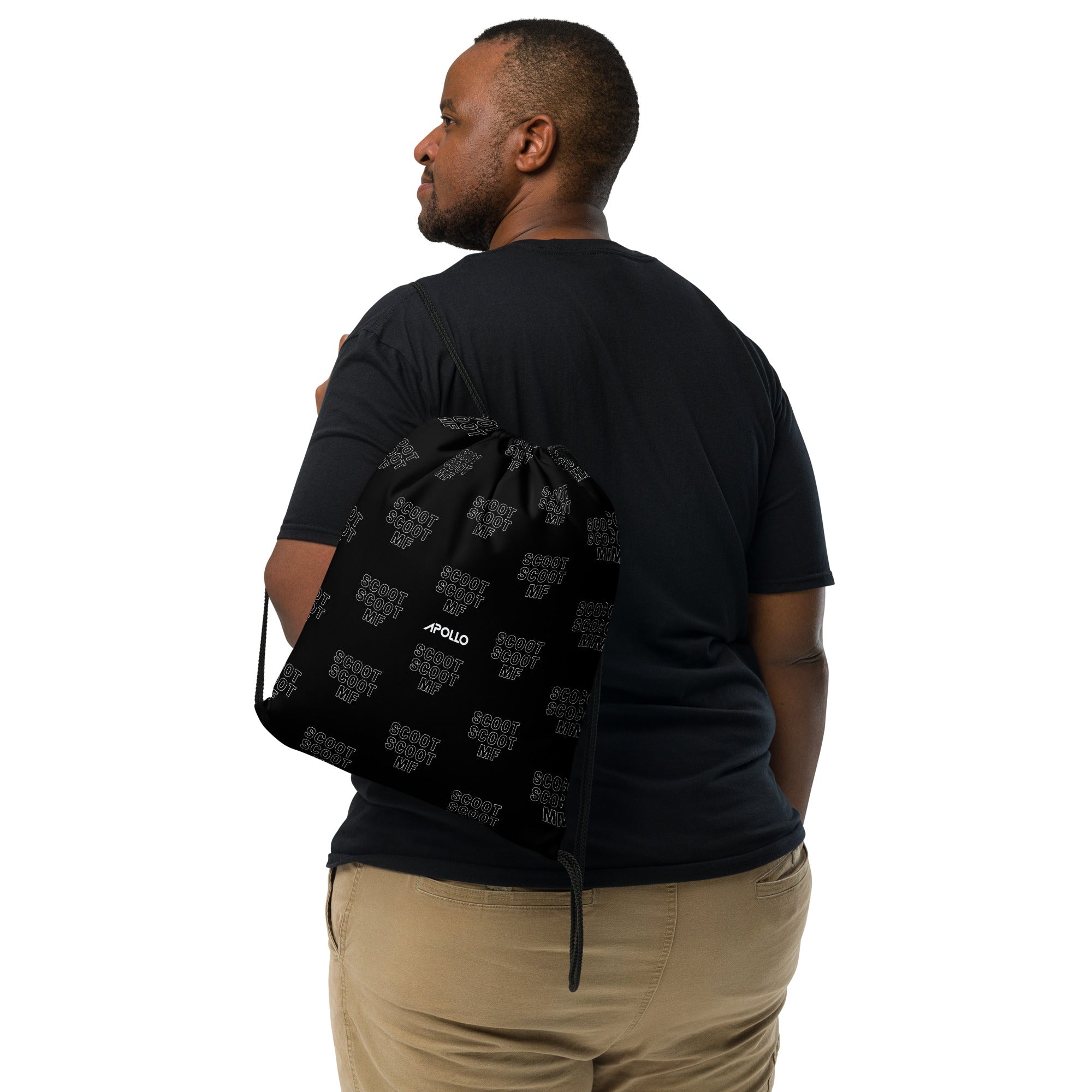 A man wearing a black color t-shirt a black backpack, Apollo text is printed on the bag.