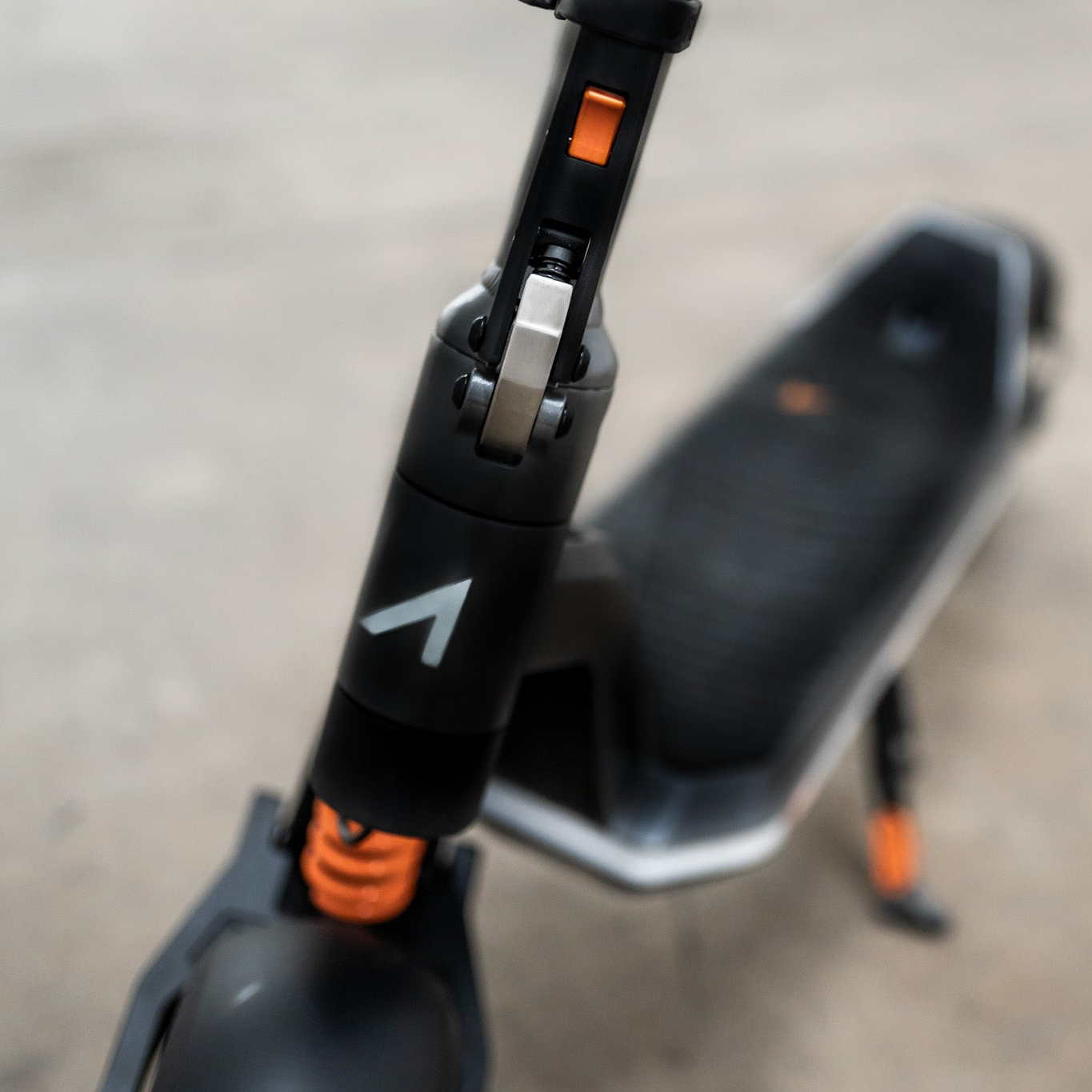 Close-up of a scooter with a visible brand logo on a blurred background