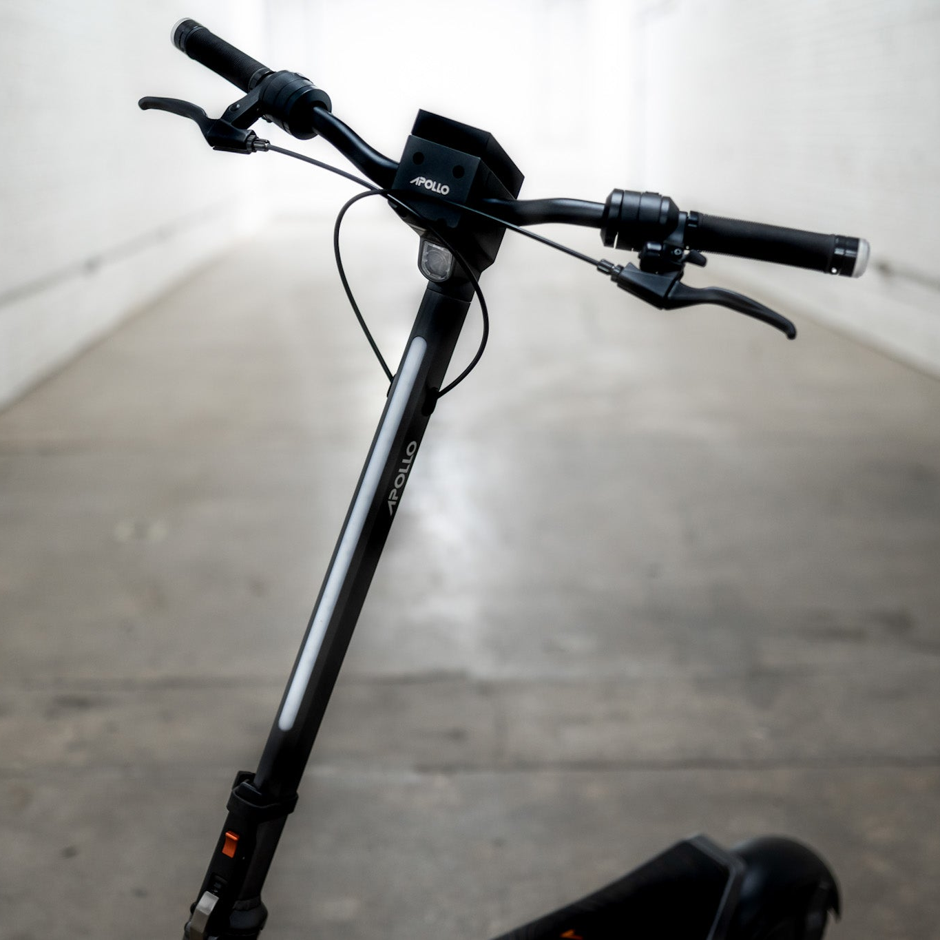 Black scooter with visible brand logo on a blurred background